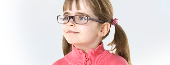 Photograph of child wearing glasses.